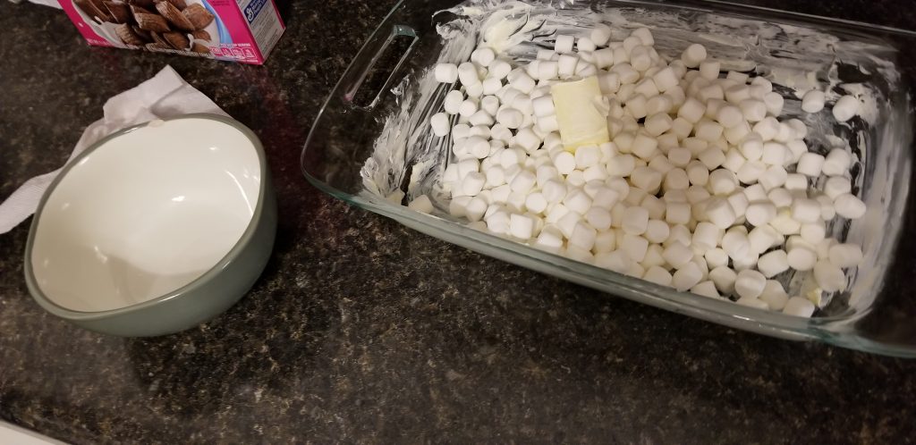 Baking pan with marshmallows and butter in it