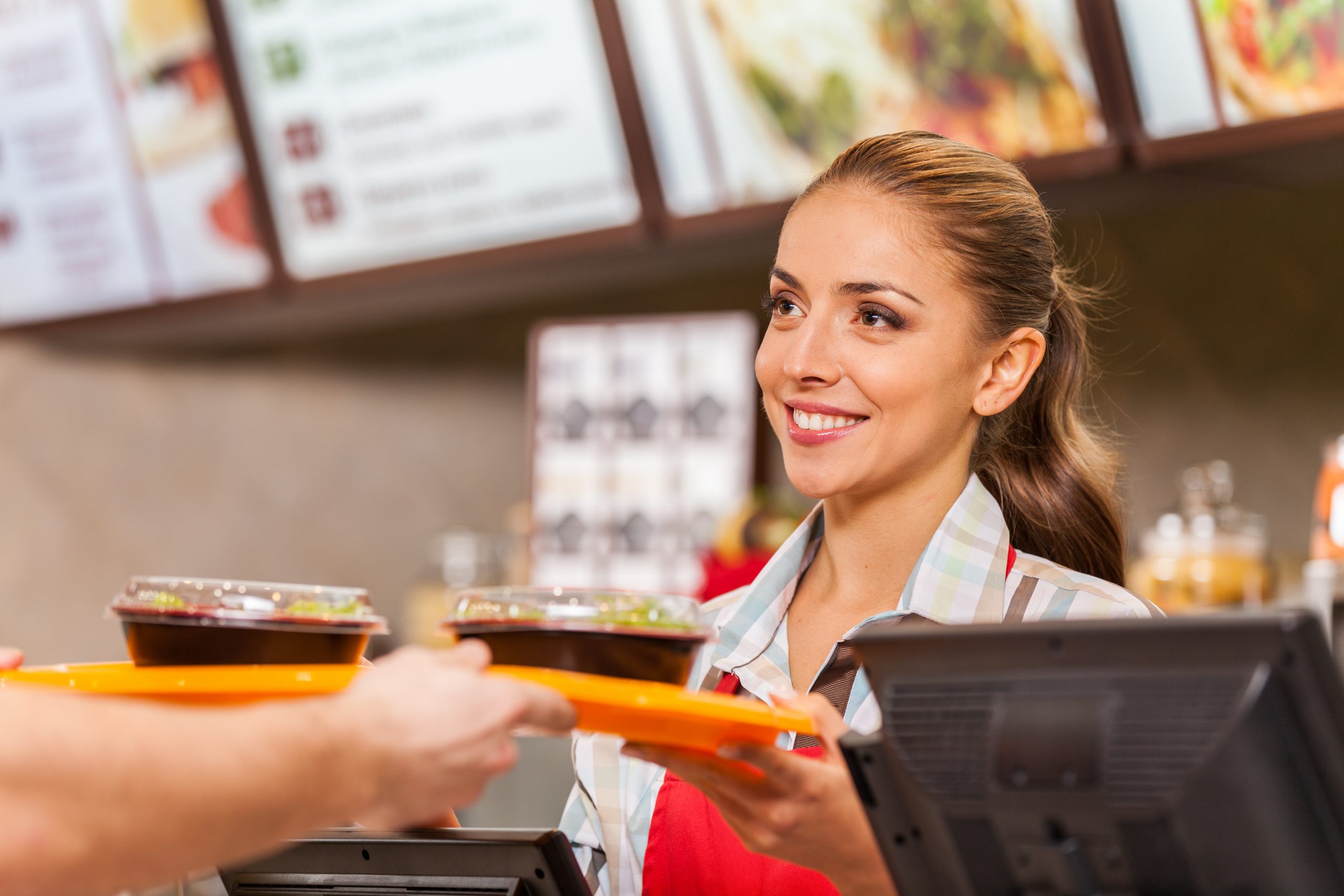 service industry worker in fast food smiling