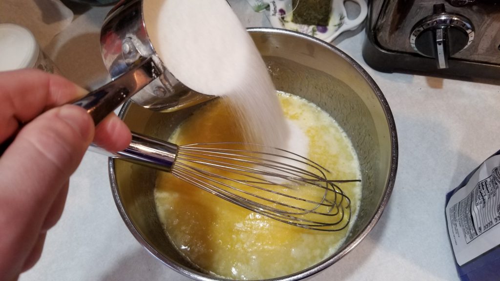pouring sugar for sugar cookie recipe