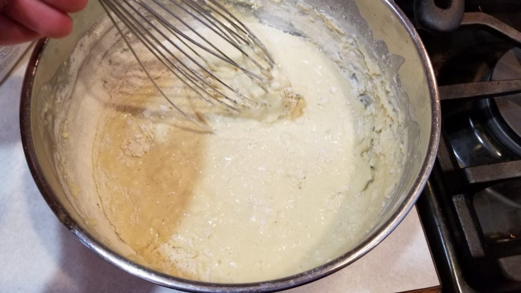 mixing batter around for waffle recipe
