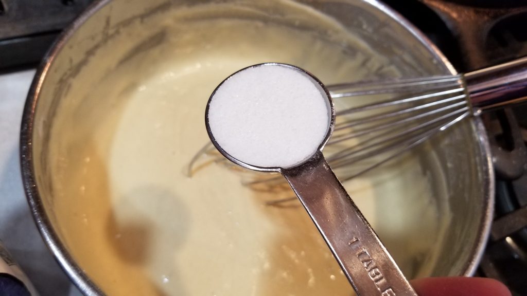 measuring sugar for waffle recipe
