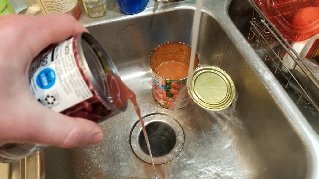 pouring out a can of beans