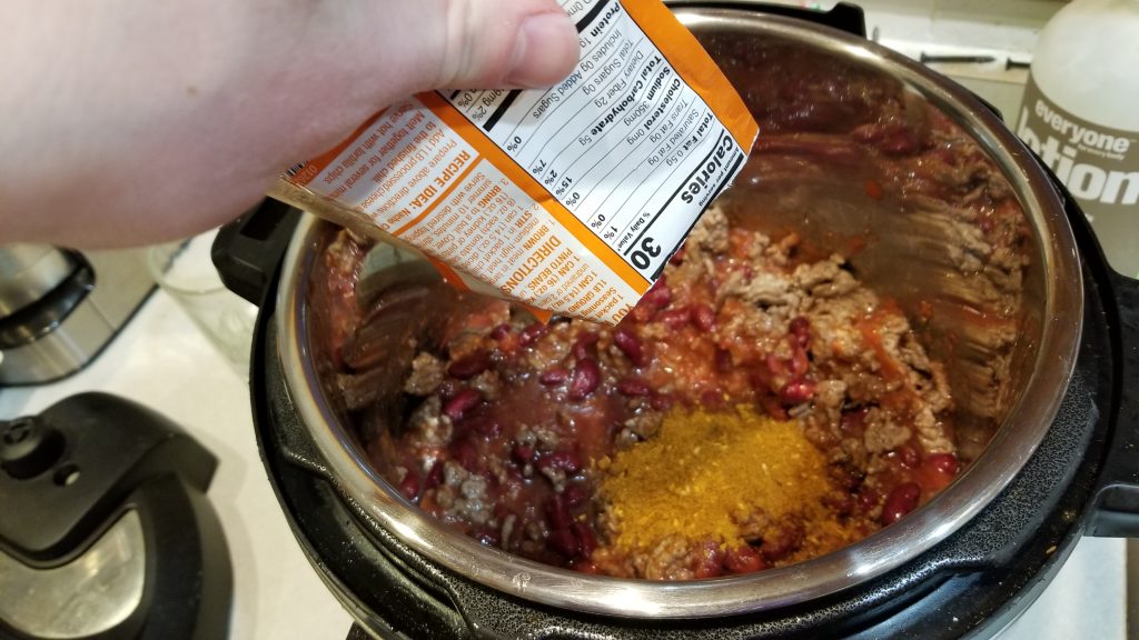Pour the entire chili packet in there