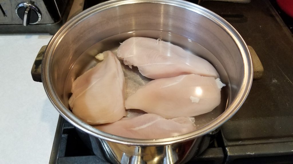 chicken breasts in a pot