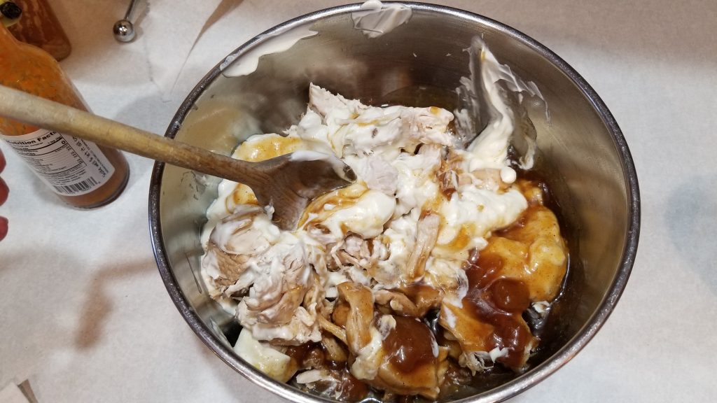 mixing ingredients for chicken salad recipe