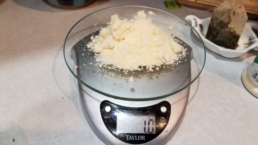 measuring cheese on a kitchen scale