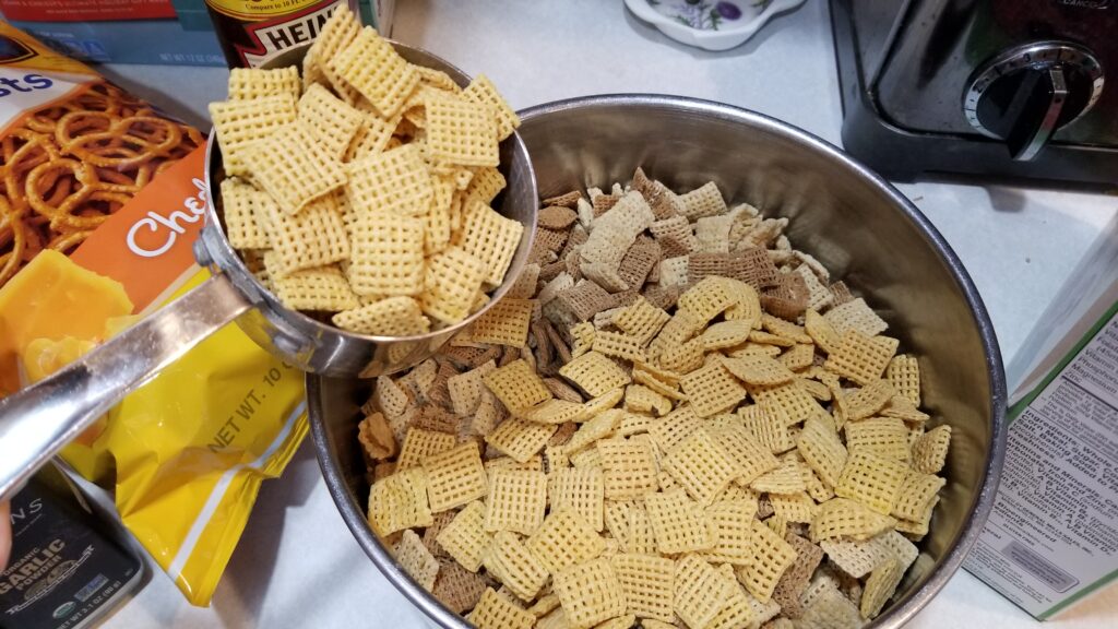pouring cereal for chex mix recipe