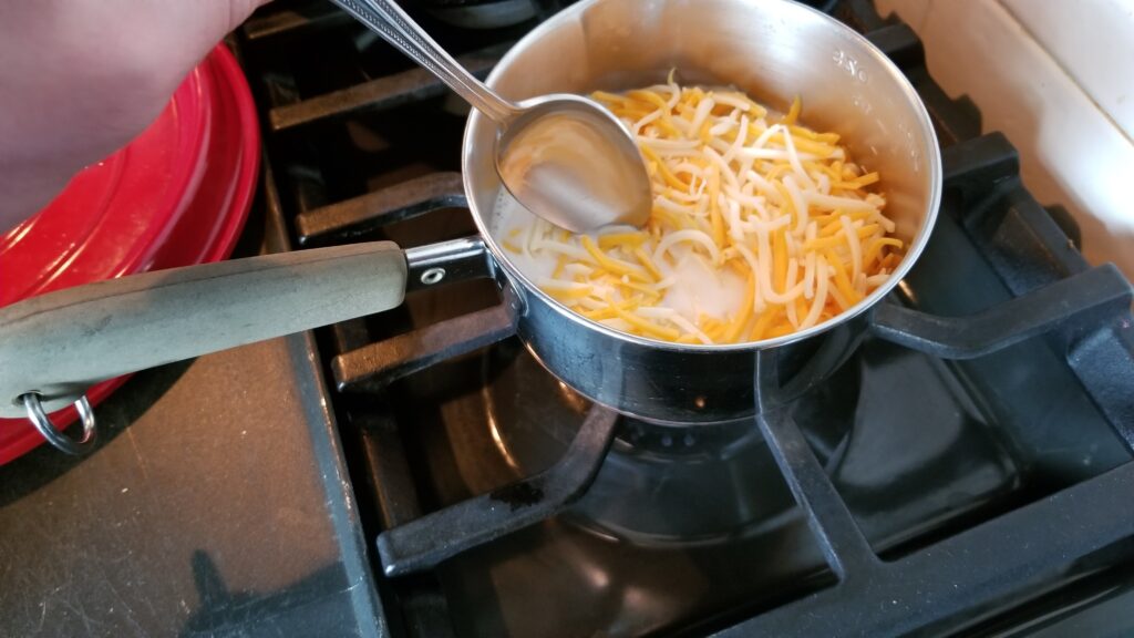 mixing cheese for mac and cheese recipe