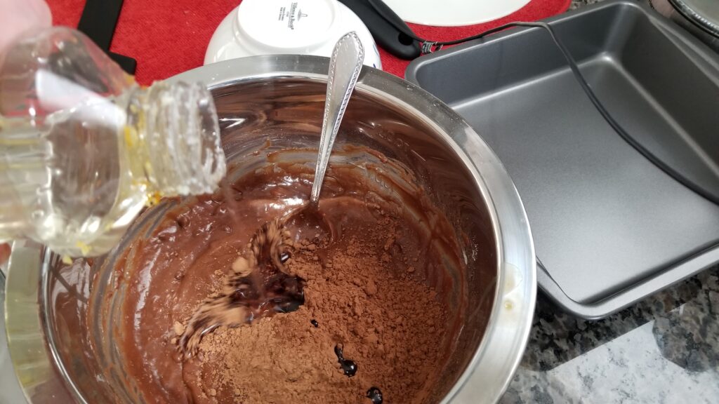 pouring thickening agent in brownie recipe