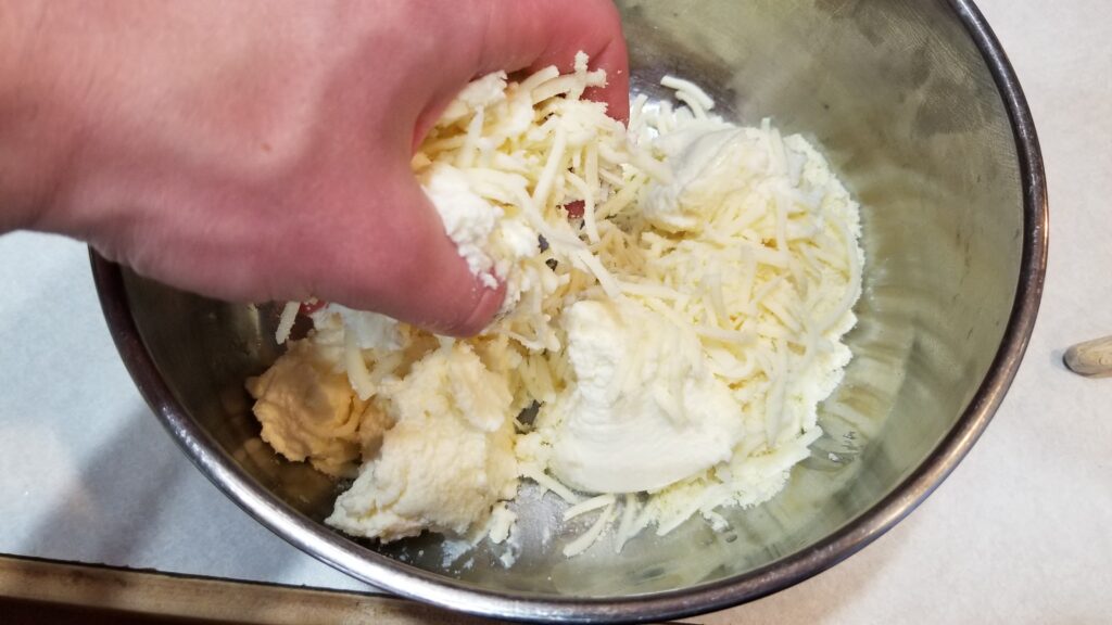 mixing cheese for manicotti recipe