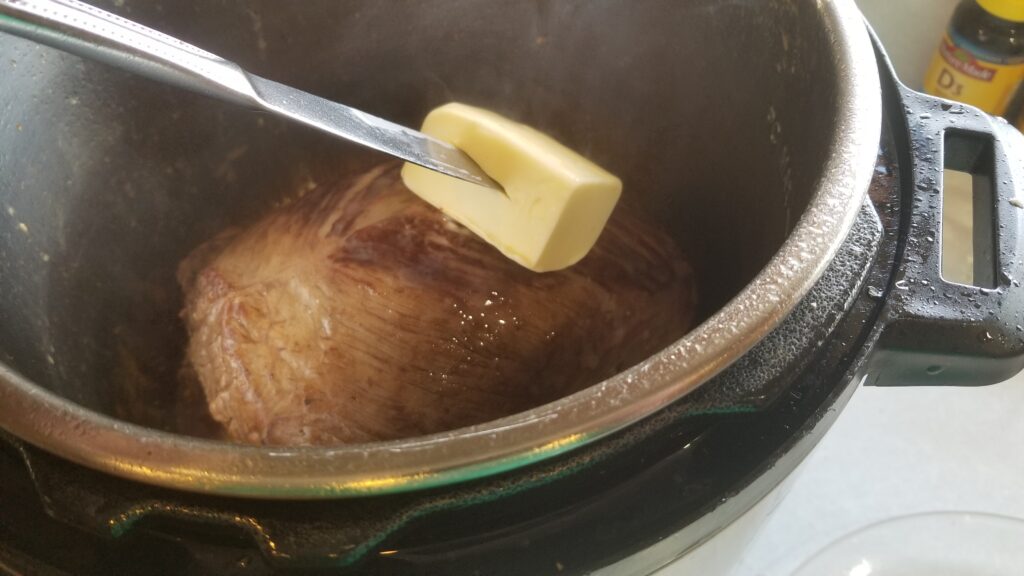 Mississippi pot roast buttering the meat