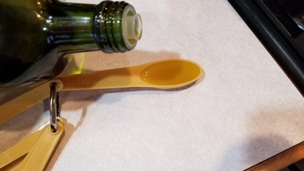 measuring out olive oil