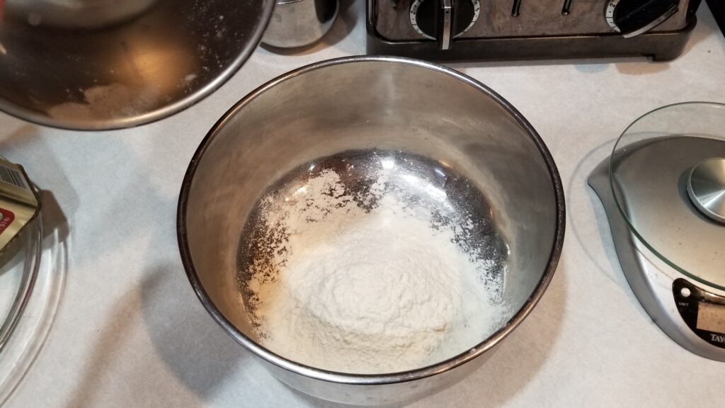 large bowl with flour in it for pumpkin pie recipe