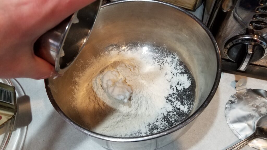 Dumping Crisco into large bowl