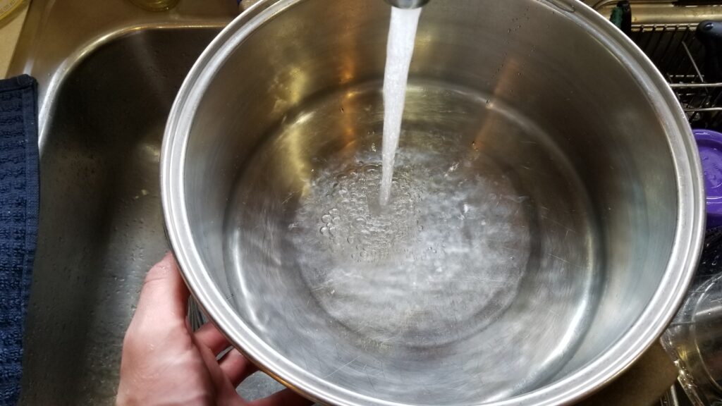 filling pot with water