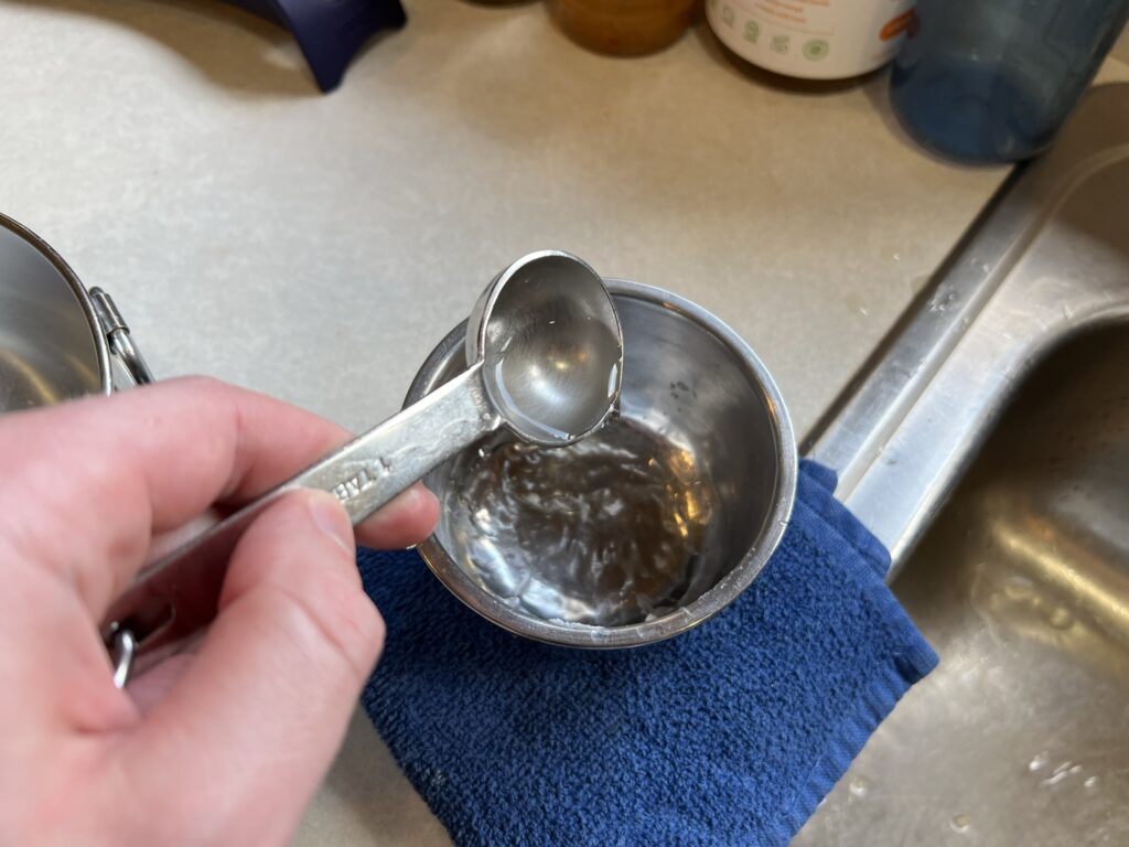 dumping water into little bowl