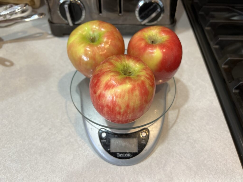 apples on scale for apple pie recipe