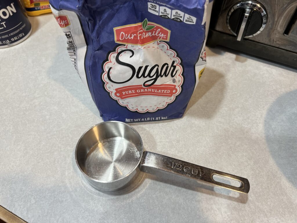 sugar with measuring cup