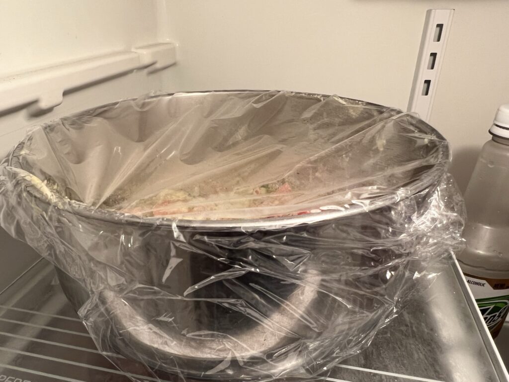 cling wrap on bowl in fridge