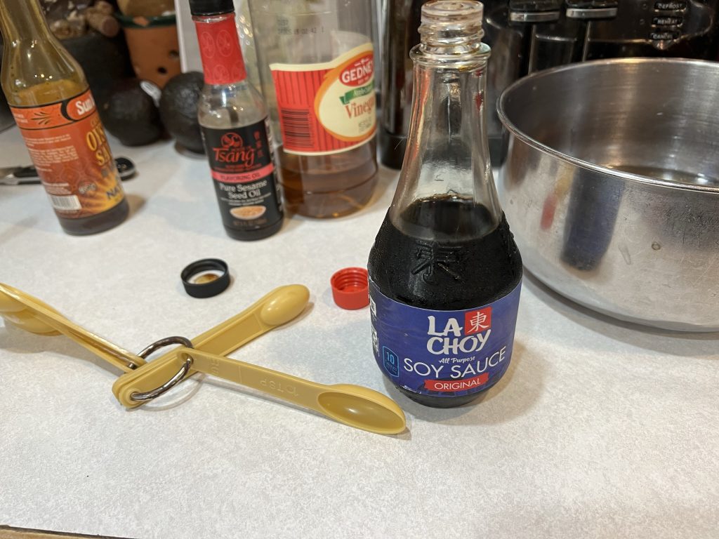 soy sauce with measuring spoons