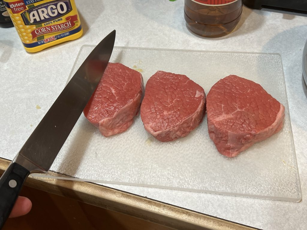 Slicing meat for beef and broccoli recipe