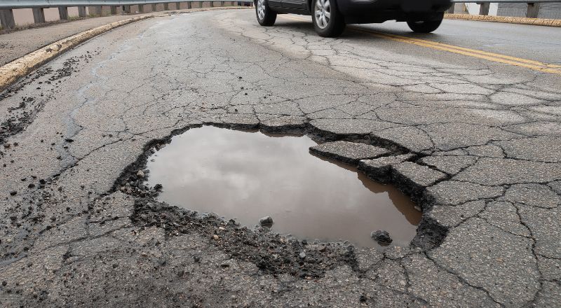 Why You Should Try To Avoid Potholes on the Road